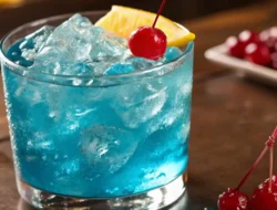 Blue Lotus Drink served in a short, wide glass filled with vibrant blue cocktail,