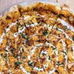 butter chicken pizza recipe creamy curry, mozzarella, and naan crust in under 30 minutes. Try this flavorful twist today!