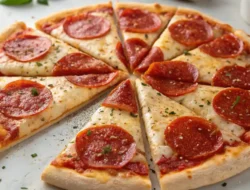 High protein pizza crust baked to a golden crisp, topped with melted cheese and pepperoni.
