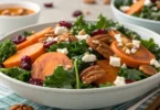 Golden roasted sweet potato cubes ready to be added to a healthy kale salad