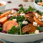 Golden roasted sweet potato cubes ready to be added to a healthy kale salad