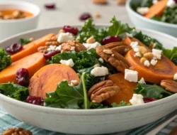 Golden roasted sweet potato cubes ready to be added to a healthy kale salad