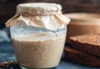 Glass jar filled with fermenting Natural Yeast water mixture