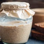 Glass jar filled with fermenting Natural Yeast water mixture