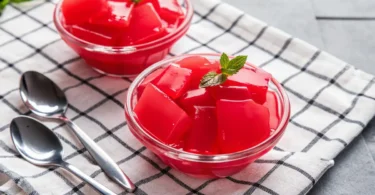 Single serving of Easy 3-Ingredient Keto Jello in a vintage glass dish, creamy, sugar-free, and ready to enjoy.
