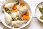 Step-by-step view showing how to boil chicken thighs perfectly in a pot of simmering broth.