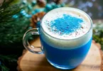 A glass of indigo-colored drink made from The Persian Blue Salt Trick Recipe, glowing under soft kitchen light.