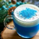 A glass of indigo-colored drink made from The Persian Blue Salt Trick Recipe, glowing under soft kitchen light.